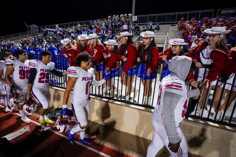Richardson JJ Pearce players, including defensive back Xavier Norris (1) celebrate with...