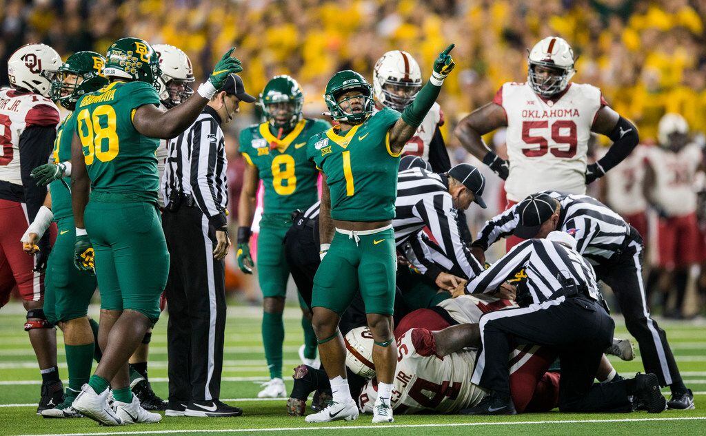 Baylor Bears recovers a fumble for a turnover during the first quarter of an NCAA football...