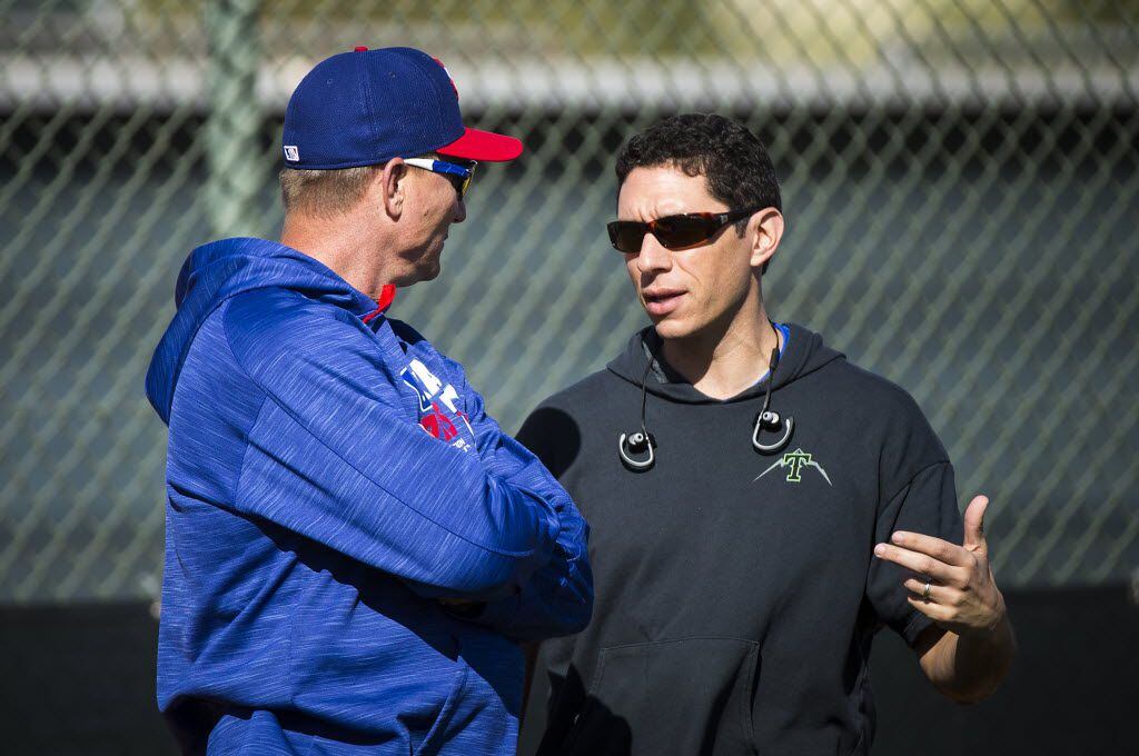 Texas Rangers General Manager Jon Daniels (left) and manager Jeff Banister watch pitchers...
