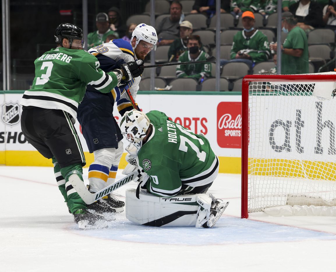 Dallas Stars goaltender Braden Holtby (70) stops the puck during the second period of a Dallas Stars preseason game against St. Louis Blues on Tuesday, Oct. 5, 2021, at American Airlines Center in Dallas. (Juan Figueroa/The Dallas Morning News)