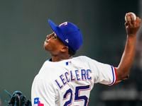 Texas Rangers relief pitcher Jose Leclerc (25) delivers during the ninth inning of the...