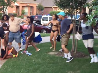 McKinney police officer Eric Casebolt pushes a girl after throwing her to the ground as a...