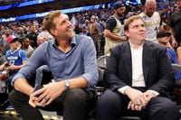 Dirk Nowitzki, former Mavericks player, left, and Patrick Dumont, new  Mavericks governor,...