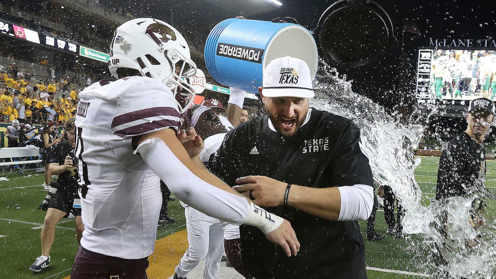 Texas State head coach G.J. Kinne, front right, is doused after his team's victory over...
