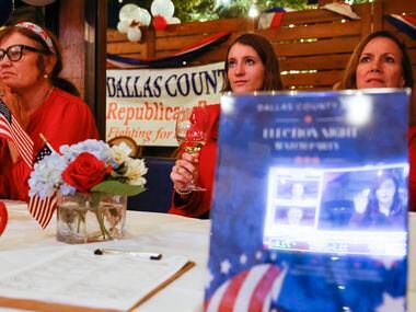 From left, Mary Brooks of Dallas, Beth and Michelle Copeland watch the electoral news during...