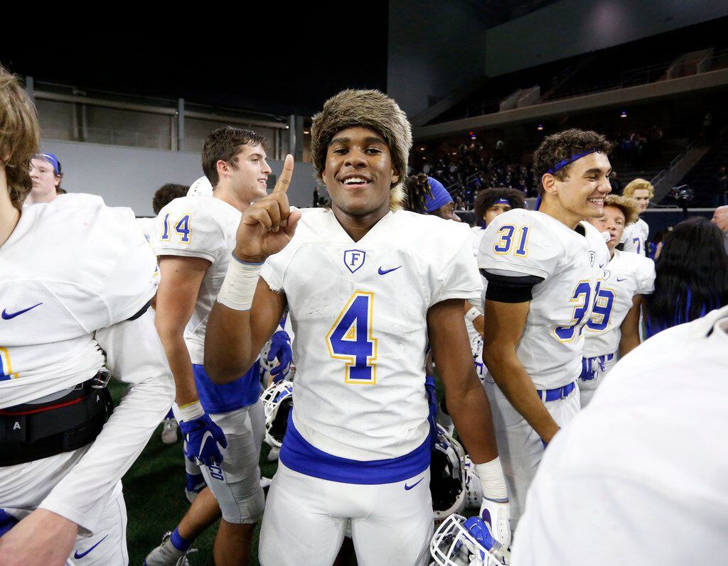 Frisco's Chase Lowery (4), clad in a raccoon skin cap, celebrates his team's  18-0 win in a...