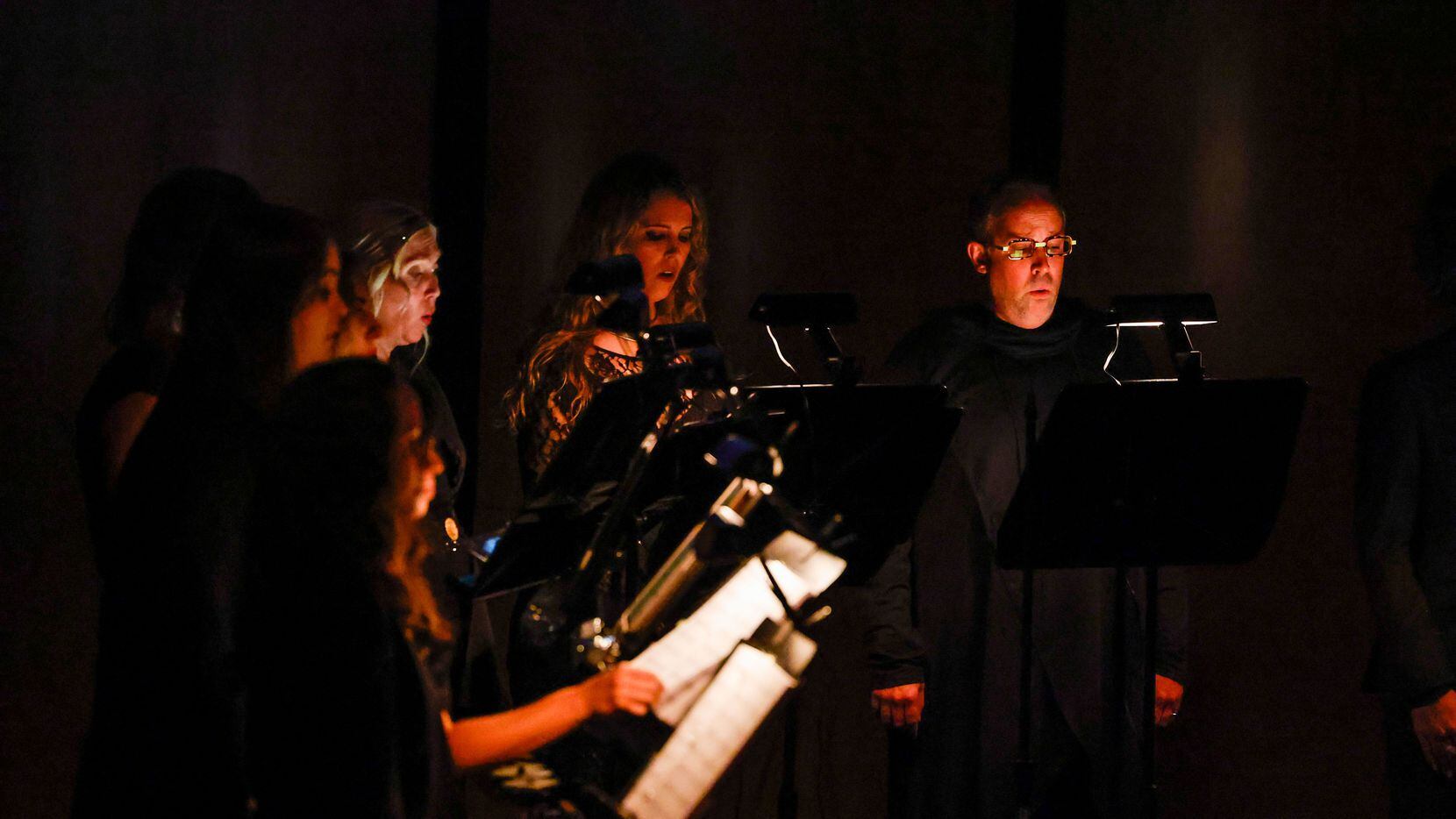 Singers from the Verdigris Ensemble, led by artistic director Sam Brukhman, perform at the...
