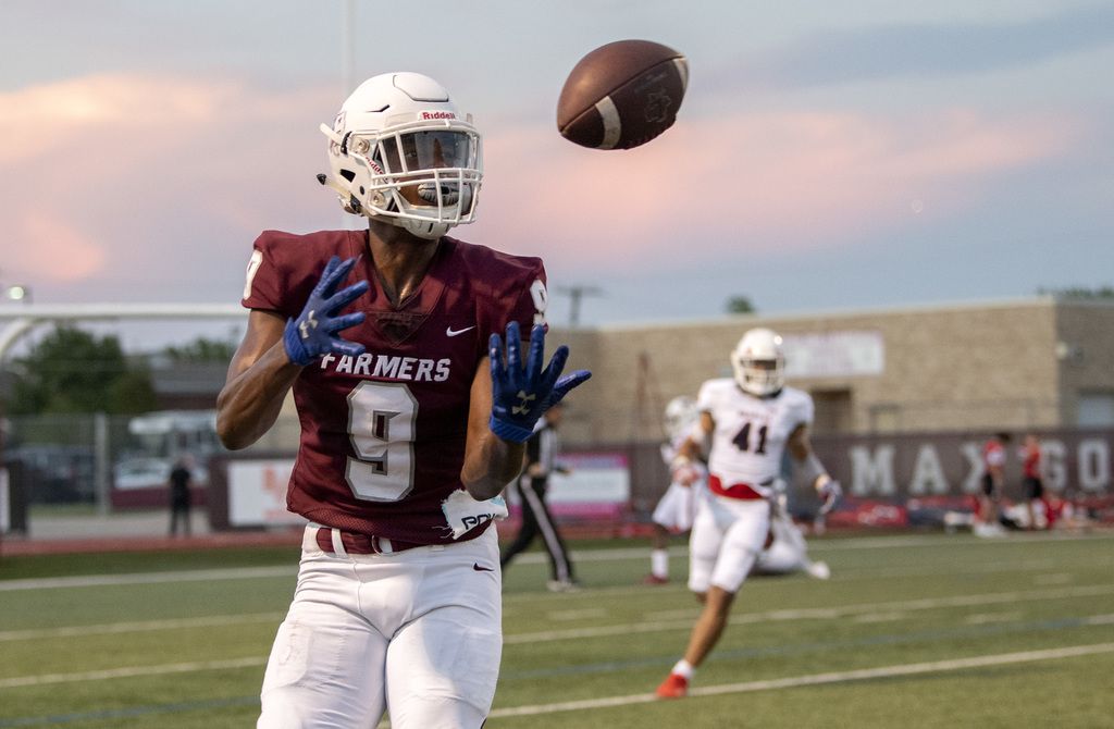 Lewisville sophomore wide receiver Armani Winfield (9) hauls in a touchdown pass after it...