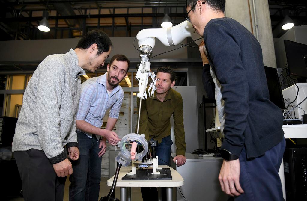 Jin Kang, from left, professor of electrical and computer engineering, Justin Opfermann,...