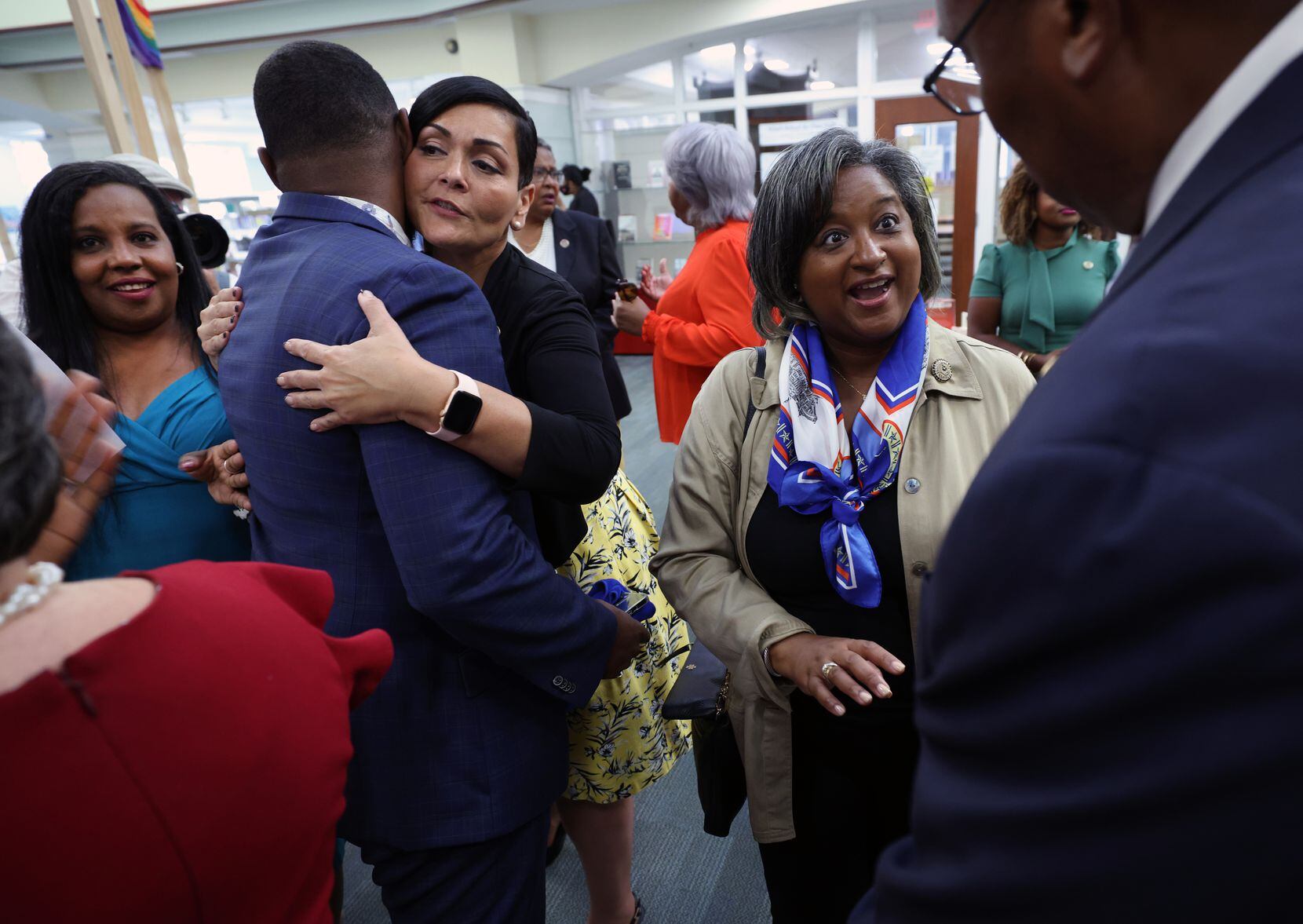 Texas State Rep. Rep. Rhetta Bowers (D-113) (R) talks to a fellow representative as Hala Ayala, Democratic nominee for Virginia lieutenant governor, greets another representative as they and other members of the Texas Legislative Black Caucus visit the Kate Waller Barrett Branch Library, the site of the 1939 Alexandria Library sit-in, where five Black men were arrested for attempting to register for a library card, on July 16, 2021 in Alexandria, Virginia. Members of Texas House Democratic Caucus continue to lobby for voting rights reform in Washington, DC after leaving Texas to block a voting restrictions bill by denying a Republican quorum.