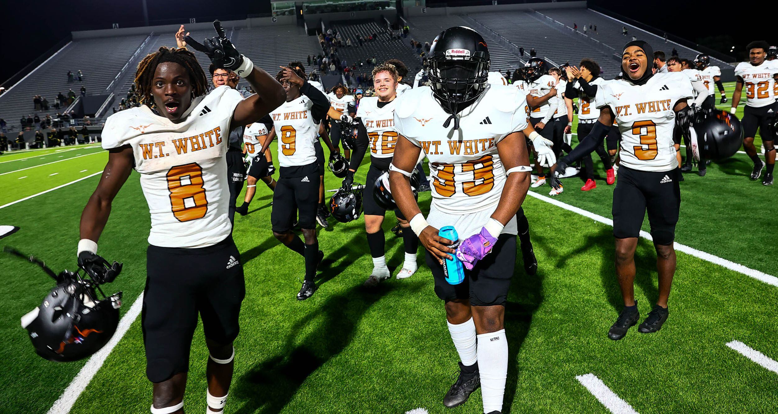 W.T. White Longhorns celebrate their victory over Birdville, 38-35 in overtime in a District...