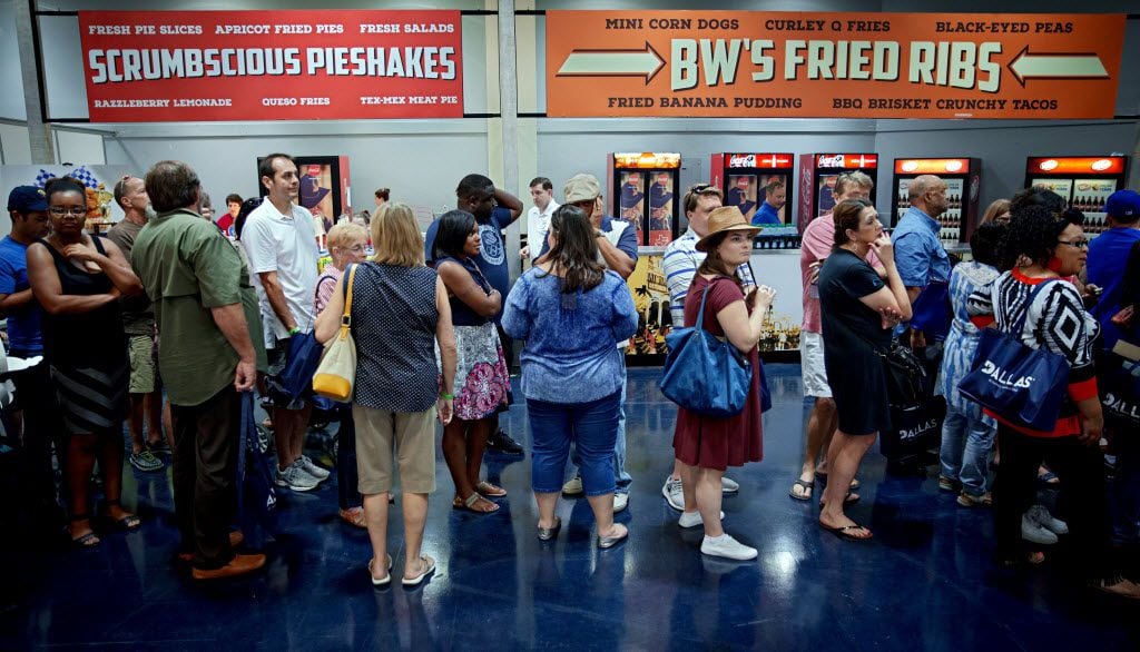 People wait in line for their turn to tries entries during the 2016 Big Tex Choice Awards Sunday, August 28, 2016 at Fair Park in Dallas. The annual event, held ahead of the State Fair of Texas, recognizes the best fried foods entered into consideration for sale at the fair. (G.J. McCarthy/The Dallas Morning News)