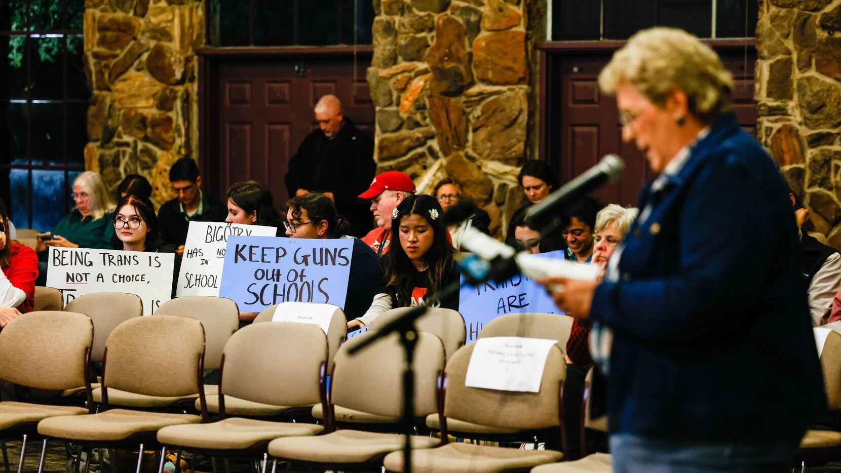 A group of Keller ISD students hold signs against the proposal that stated employees could...