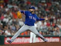 Texas Rangers starting pitcher Martin Perez throws against the Texas Rangers during the...