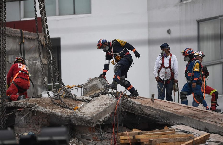 Rescuers continue to search for victims in the rubble of the collapsed Alvaro Obregon...