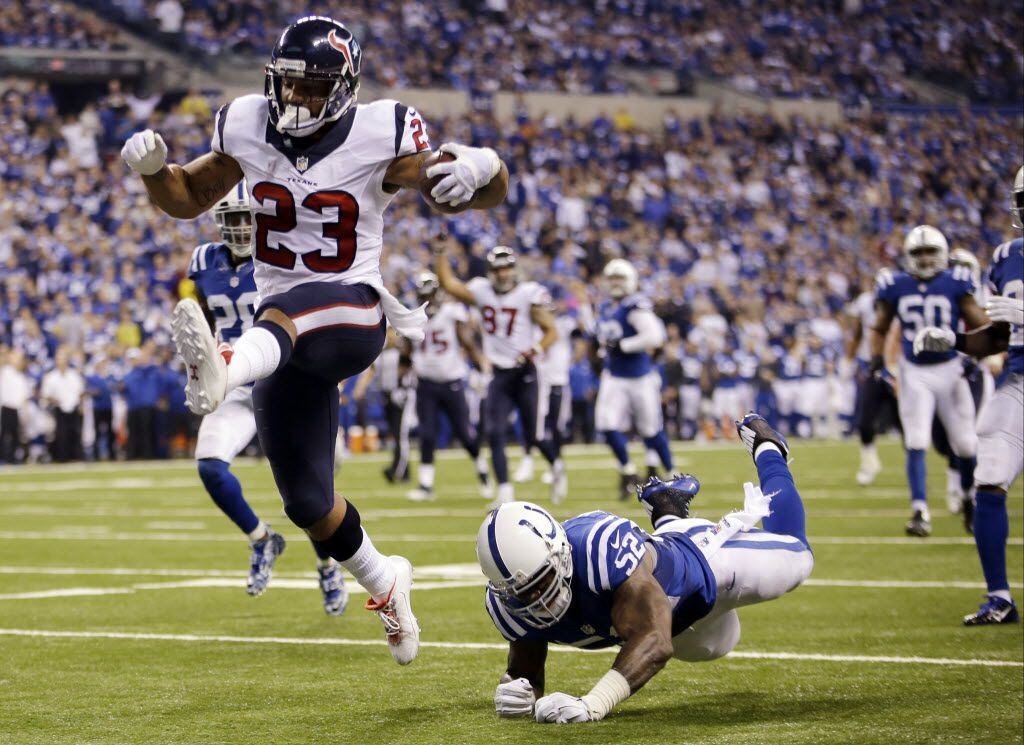 FILE - In this Dec. 14, 2014, file photo, Houston Texans running back Arian Foster (23) gets...