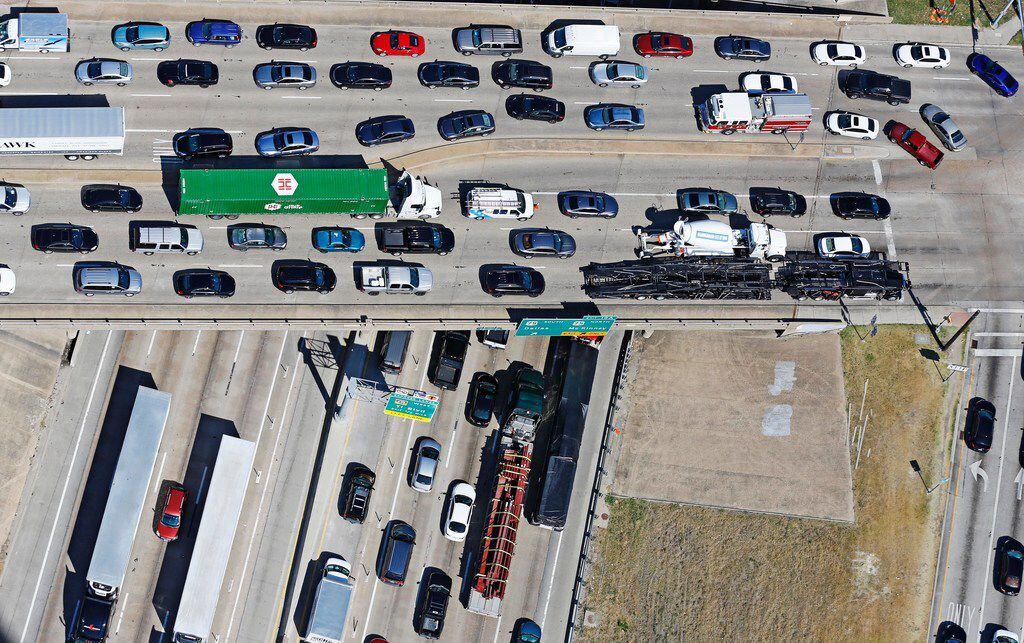 Traffic stacks up on the Greenville Avenue overpass over LBJ 635 as the intersection of...
