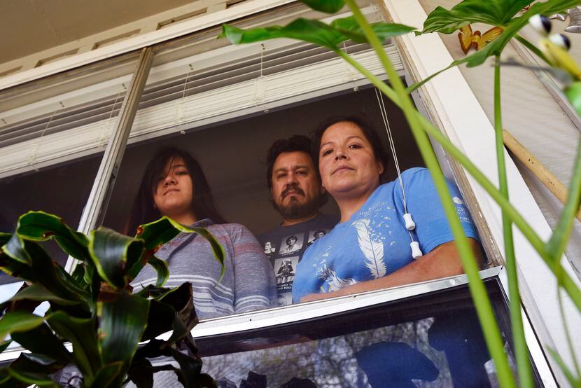 Aurora Salazar (right) is shown with husband Alberto Hernandez and one of their kids, Karina...