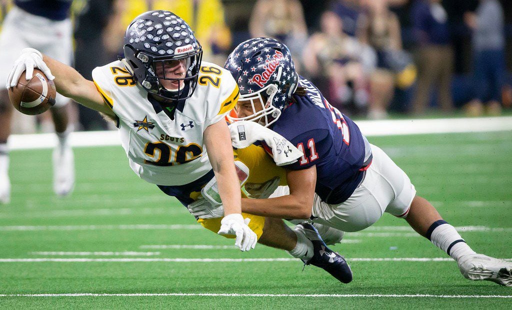 Highland Park wide receiver Ben Smith (26) dives for extra yardage as he is brought down by...