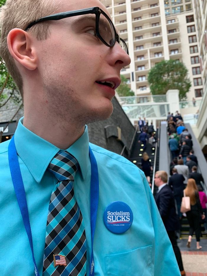 College student James Stevens, 20, wears a Socialism SUCKS button at annual Conservative Political Action Conference (CPAC) in National Harbor, Maryland, on March 1, 2019. - Twenty months before Americans vote on re-electing Donald Trump, conservative supporters are already slapping many of his progressive 2020 challengers with a resurgent political taint: socialist. The word has been in heavy rotation since Democratic candidates began openly embracing far-left platforms including a sweeping plan to fight climate change.