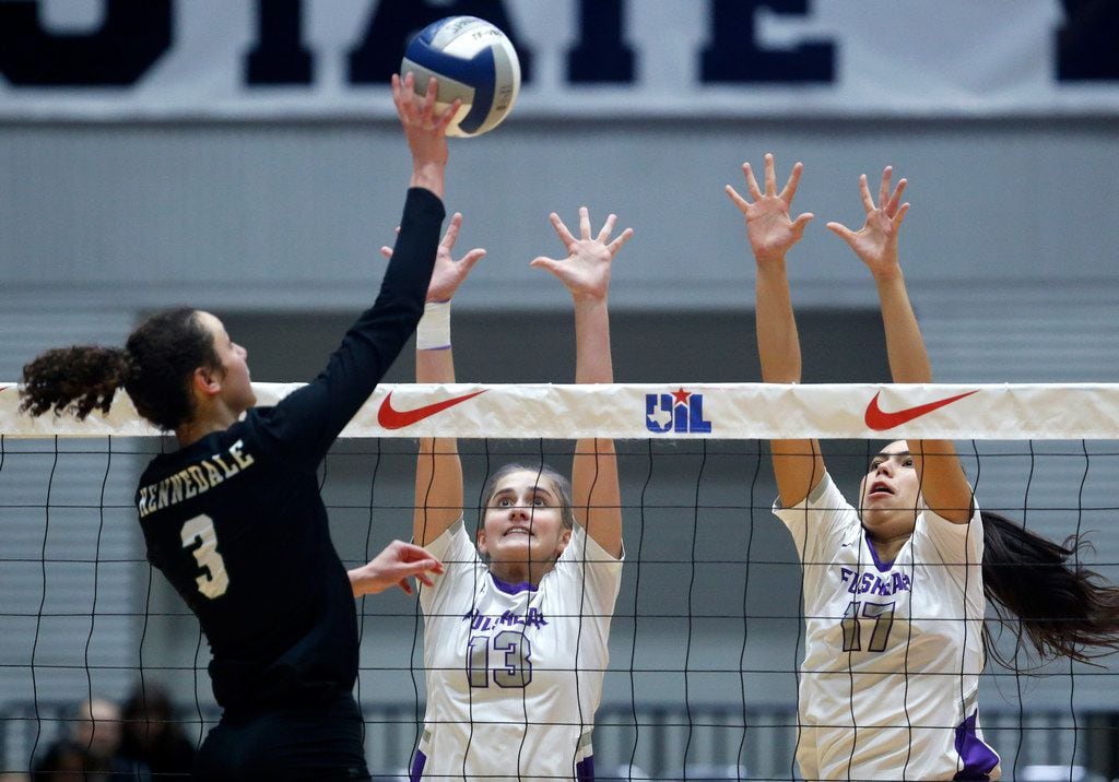 Kennedale Madeline Pyles (3) hits the ball over Lamar Fulshear's Shelby Tally (13) and...