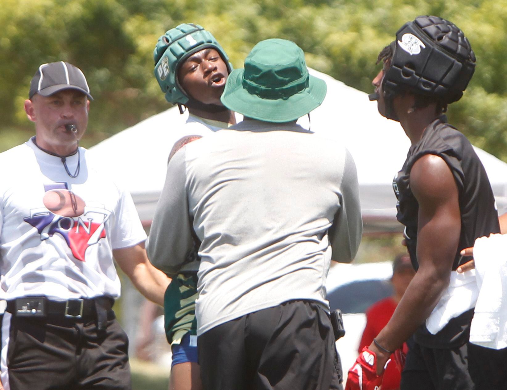DeSoto receiver Johntay Cook ll (1), upper center, reacts as Eagles head coach Claude Mathis...