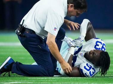 Dallas Cowboys defensive end Tarell Basham (93) reacts after being injured during the fourth...