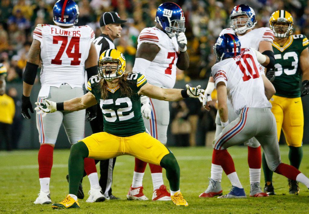 Green Bay Packers' Clay Matthews celebrates a sack of New York Giants quarterback Eli...
