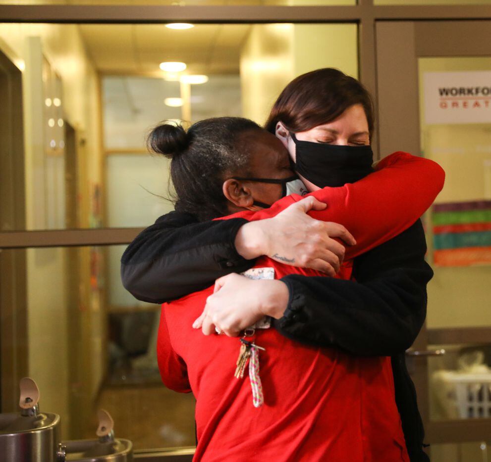 Patricia Freeman (left) embraces The Bridge Homeless Recovery Center staff member Kelly Kane...