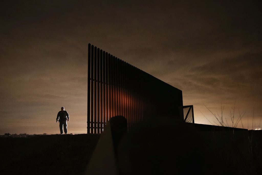 U.S. Border Patrol agent Sal De Leon stands near a section of the U.S.- Mexico border fence...
