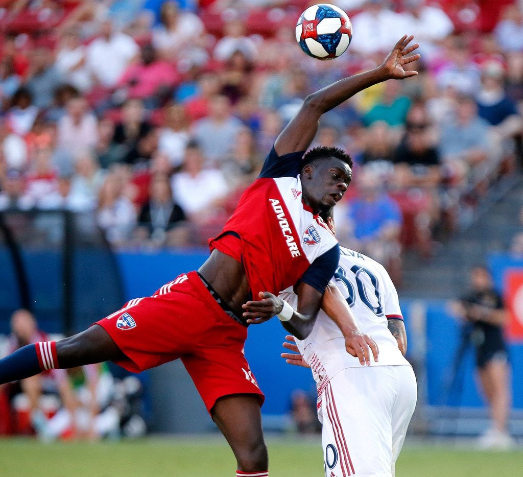 FC Dallas forward Dominique Badji, left, is unable to reach the ball over Real Salt Lake...