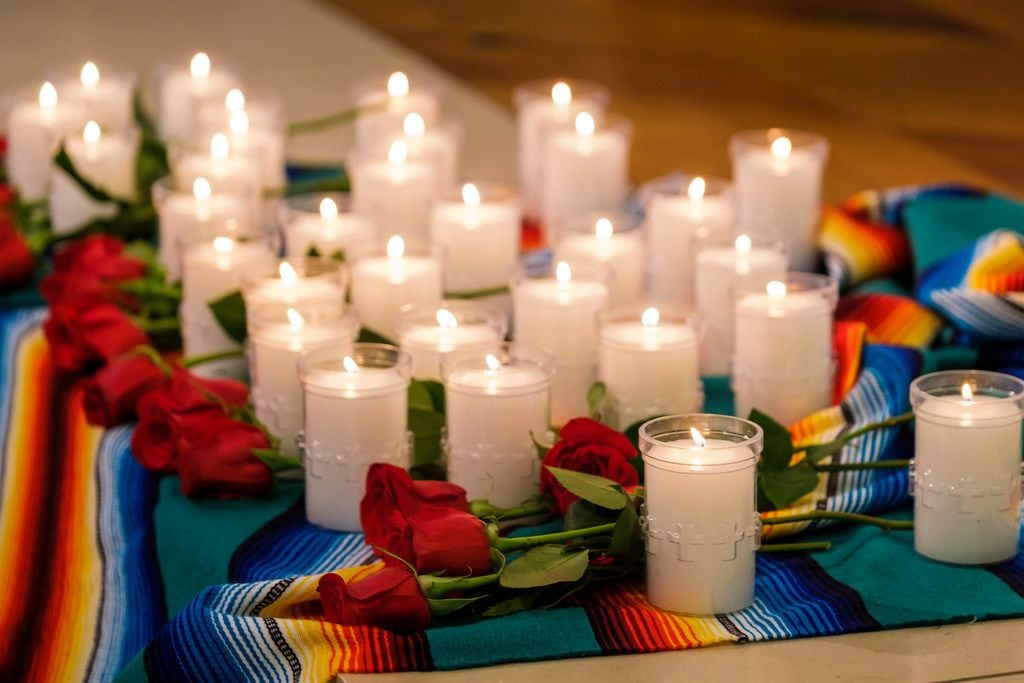 Thirty-one candles and roses, to remember the 31 people killed in two mass shootings, rest...