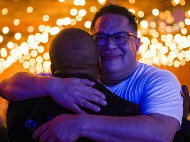 Venton Jones (left) is hugged by City of Dallas deputy mayor pro tem Omar Narvaez after...