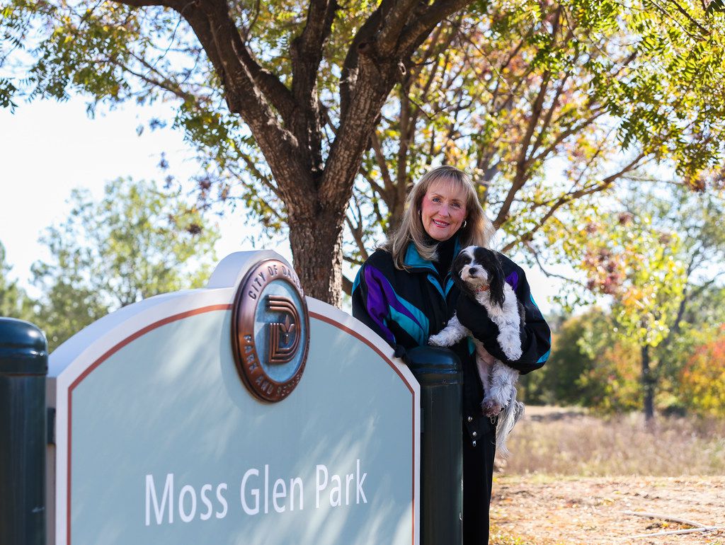 Betti Coffey with her dog Molly at Moss Glen Park in Dallas. She accepted her late husband...