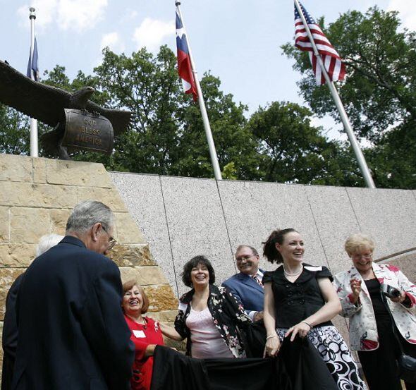 John Danish, far left, a chairman of Irving Veterans Memorial Park Committee, and other...