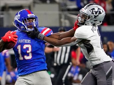 Duncanville wide receiver Roderick Daniels (13) is brought Arlington Martin defensive back KJ Polk, Jr., on a 66 yard run during the second half of a Class 6A Division I Region I semifinal playoff football game at AT&T Stadium non Friday, Nov. 29, 2019, in Arlington. (Smiley N. Pool/The Dallas Morning News)