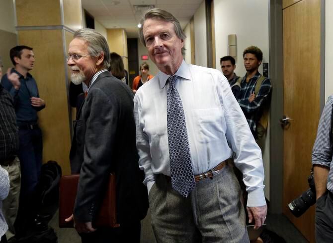 
University of Texas at Austin President Bill Powers (center) waited to return to a UT Board...