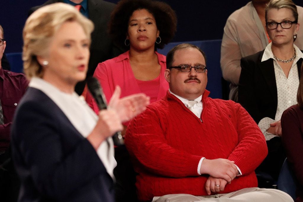 Kenneth Bone listens as Democratic presidential nominee Hillary Clinton answers a question...