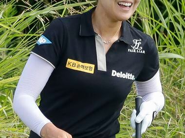 Professional golfer In Gee Chun reacts after playing out of the No. 8 green side rough...
