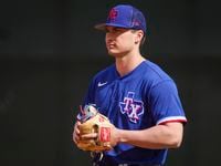 Infielder Justin Foscue participates in a drill during a Texas Rangers minor league spring...