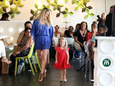 Sarah Vobora models with daughter Elealeah Vobora at a fashion show event benefiting Genesis...