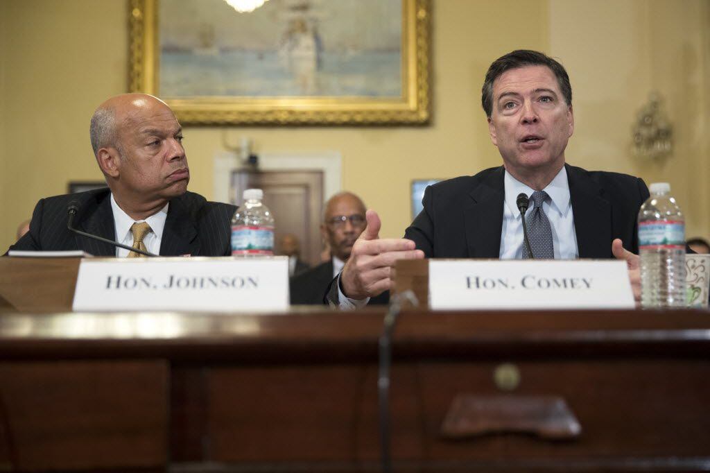 Homeland Security Secretary Jeh Johnson (left) and FBI Director James Comey testify at a...