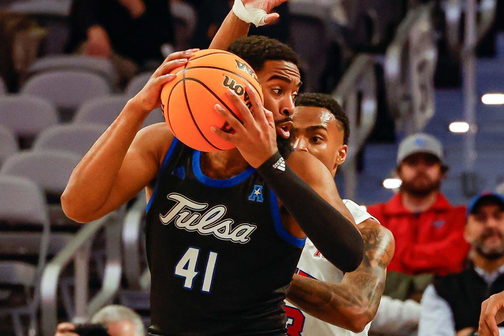 Tulsa Golden Hurricane forward Jeriah Horne (41) protects the ball from Southern Methodist...
