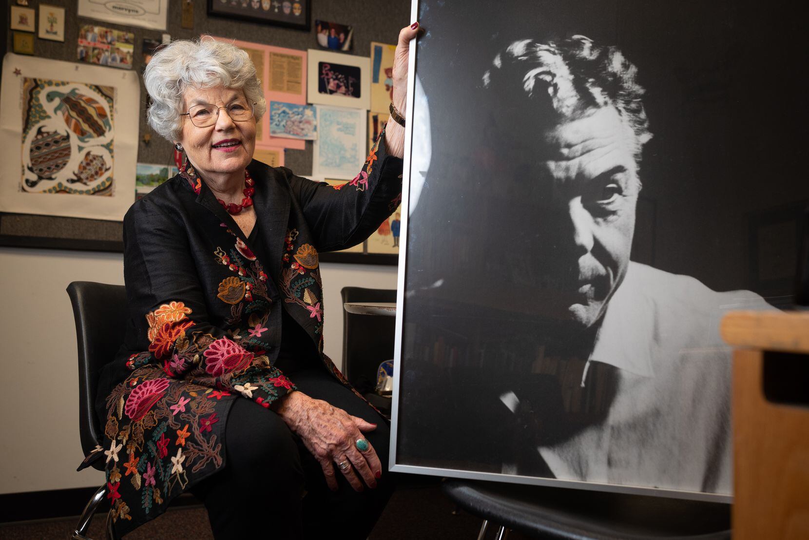 Robyn Flatt, co-founder of the Dallas Children's Theater, shown with an image of her father...
