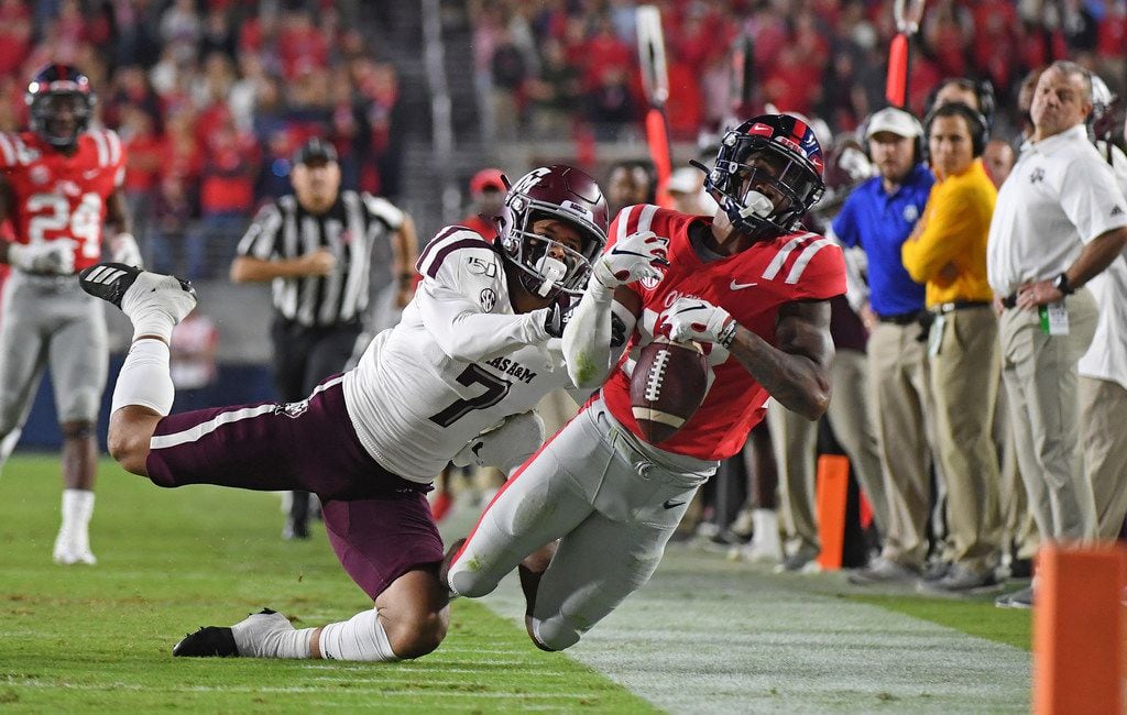 Mississippi wide receiver Braylon Sanders (13) attempts to catch a pass over Texas A&M defensive back Devin Morris (7) during the first half of an NCAA college football game in Oxford, Miss., Saturday, Oct. 19, 2019. (AP Photo/Thomas Graning)