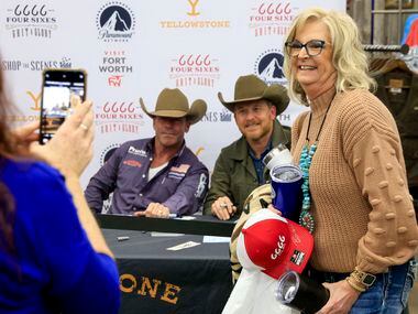 Christine Watters smiles as she poses for a photo with “Yellowstone” creator Taylor Sheridan...