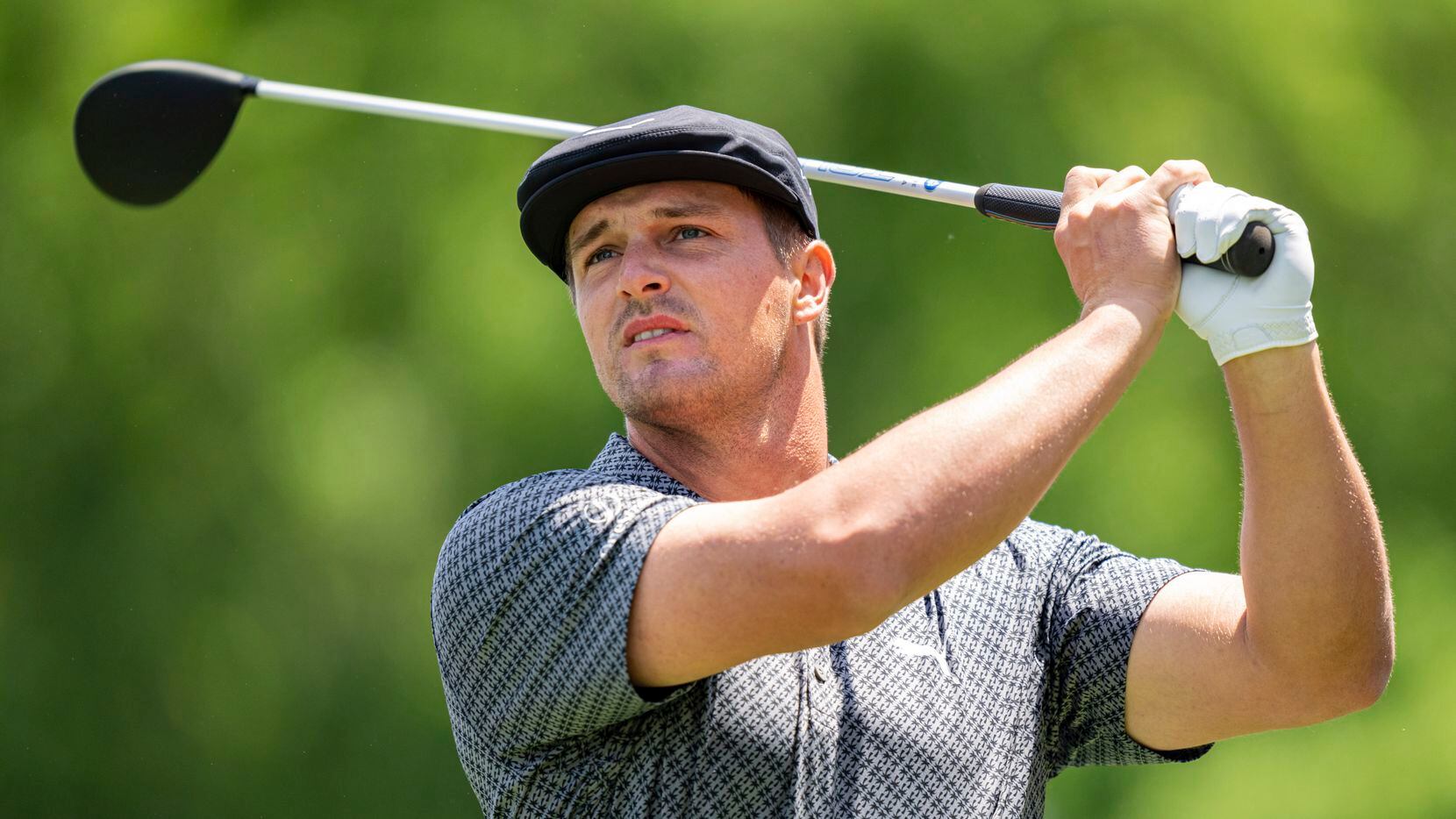 Bryson DeChambeau watches his tee shot on the third hole during the first round of the Wells Fargo Championship golf tournament at Quail Hollow Club on Thursday, May 6, 2021, in Charlotte, N.C.