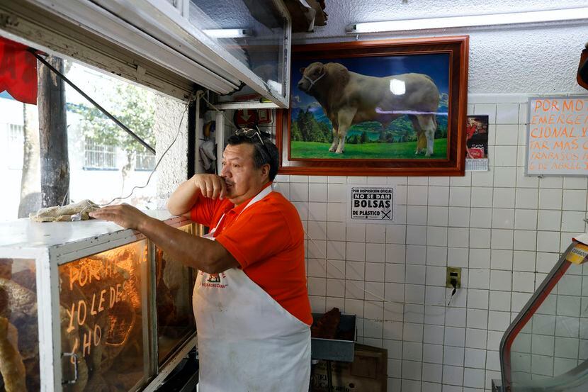 Butcher Juan Manuel Reza decided to close his shop in Mexico City to discourage community...