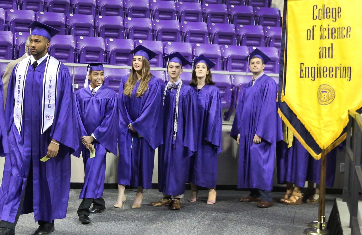 14-year-old Carson Huey-You, second from left, walks into the arena with fellow students as...