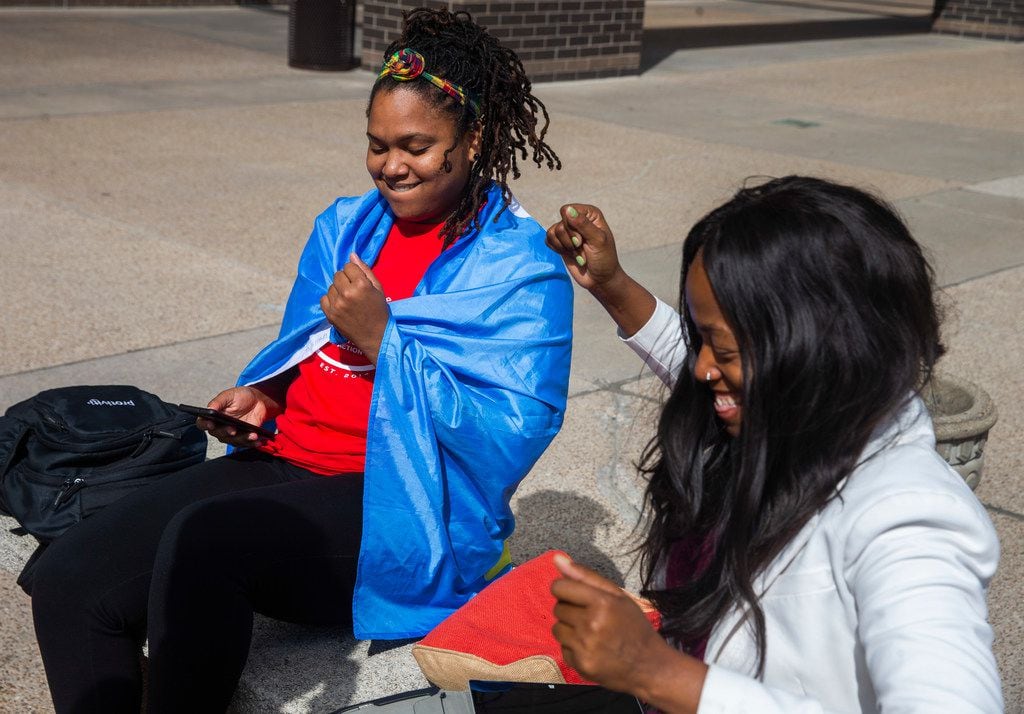 Activists Safiya Paul and Tamara Neil dance outside the Dallas County courthouse to...
